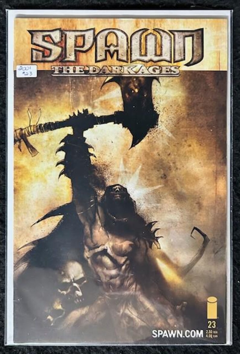 May include: A comic book cover featuring Spawn, a dark, muscular figure with a large axe, against a brown and gold background. The title "Spawn The Dark Ages" is displayed in bold, black letters. The issue number "23" is in the bottom right corner.