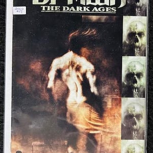 May include: A comic book cover featuring a dark, gritty image of Spawn, a superhero character, with the title "Spawn The Dark Ages" and the issue number "17".