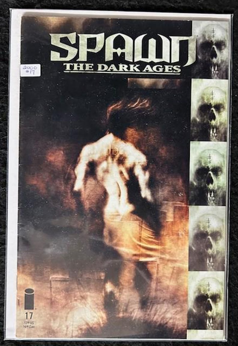 May include: A comic book cover featuring a dark, gritty image of Spawn, a superhero character, with the title "Spawn The Dark Ages" and the issue number "17".