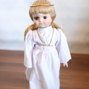 Vintage House of Lloyd, Christmas Around the World, Reluctant Angel Doll, 16 inches tall,  Original box, Doll is in like new condition.