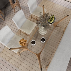 wooden dining table, with a style of precise nautical details, contemporary glass, aerial view, modernist influences, a dining table and chairs on a wooden floor, coffee  on the table, vase on the table, bench in the dining room, messa glass and wood