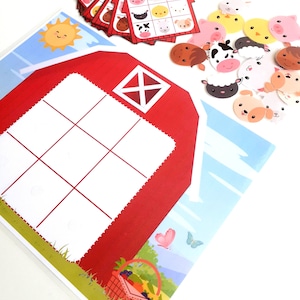 May include: A red barn with a white grid and a basket of fruit in front of it. There are farm animal stickers on the barn and scattered around it. The stickers include a cow, pig, sheep, chicken, and horse.