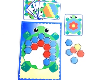 May include: A colorful turtle-shaped puzzle with hexagonal pieces. The puzzle includes a base with a turtle design and a set of hexagonal pieces in blue, red, and yellow. The pieces can be arranged to create different patterns on the turtle's shell.