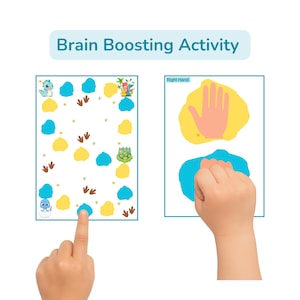 May include: A children's educational activity with the text "Brain Boosting Activity." The image shows two hands interacting with colorful illustrations. One hand points to a dinosaur-themed game board with blue, yellow, and brown elements. The other hand interacts with a hand-shaped illustration.