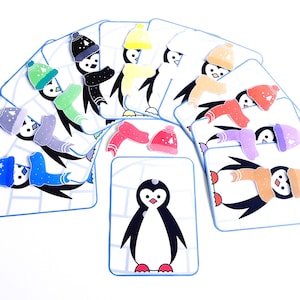 Op de afbeelding: Een set pinguïnkaarten met verschillende gekleurde hoeden en sjaals. De kaarten zijn ontworpen voor matching-spellen en activiteiten.