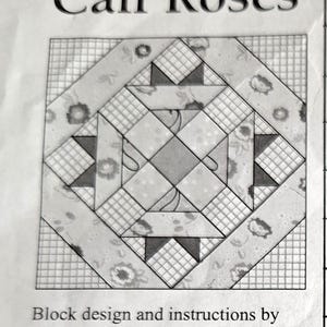 May include: A black and white Cali Roses quilt block design. The design features a central square surrounded by geometric shapes and floral patterns. Text at the top reads "Cali Roses". The design is by Marti Michell and the fabric kit is by Quilters Quarters.