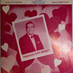 Puede incluir: Portada de partituras titulada "Can You Find it in Your Heart?" con un retrato de Tony Bennett. La portada es predominantemente roja con formas de corazón y texto. El texto incluye los nombres del letrista, compositor y editor.