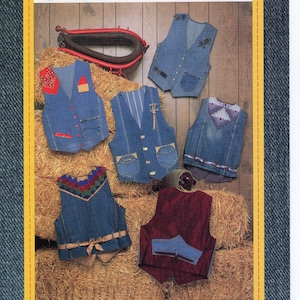 May include: A collection of denim vests with various designs, displayed on hay bales. The vests are in shades of blue and burgundy, with decorative elements. The image includes the text "Junk-Jeans Designer Vests" and "Copyright 1990 CB NICKELS".