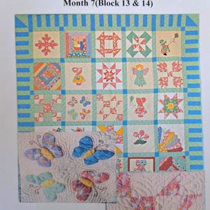 May include: A patchwork quilt with a variety of colorful squares, featuring floral and butterfly designs. The quilt has a blue and green border and includes the text "Memories of Granny Jo".