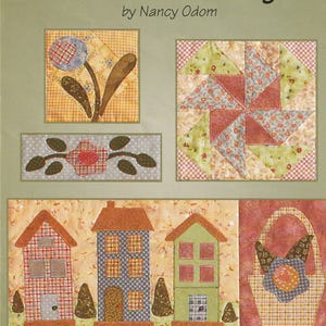 May include: A quilt pattern titled "Rosewood Cottage" by Nancy Odom. The design features various quilt blocks, including floral motifs, houses, and a basket. The pattern is part three of a six-part series.