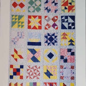 May include: A set of 16 miniature quilt block templates, each measuring 4 inches. The templates are arranged in a grid pattern and feature a variety of colorful designs. The title "Quilter's Miniature Template Set" and "Come Quilt With Me" are printed at the top of the image. The website address "ComeQuiltQithMe.com" and phone number "Ph 718-377-3652" are printed at the bottom of the image.