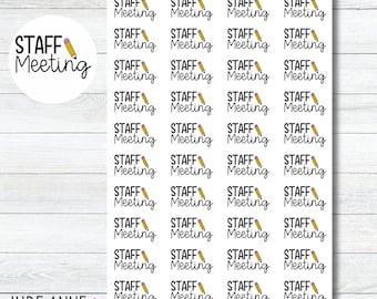 May include: Sheet of stickers with the text "STAFF Meeting" in a handwritten font, each accompanied by a small pencil illustration. The stickers are arranged on a white background with a wood grain pattern.