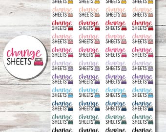 May include: A sticker sheet featuring multiple rows of small labels with the text change SHEETS in various colors, accompanied by a tiny bed icon. A circular sticker with the same text and bed icon is positioned to the left of the main sheet.