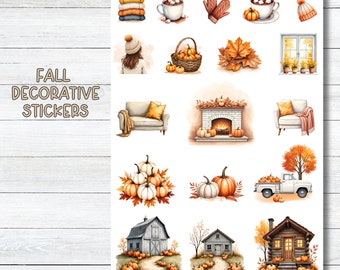 May include: A sheet of fall decorative stickers labeled JUDE ANNE featuring illustrations of sweaters, hot cocoa, mittens, pumpkins, baskets, autumn leaves, windows, sofas, fireplaces, trucks, barns, and cabins in warm seasonal colors on a white background.