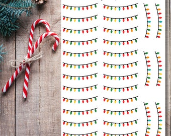 May include: A sheet of printable Christmas light stickers with a variety of designs. The stickers feature strings of lights with red, yellow, green, and blue bulbs. The sheet also includes some half-circle designs with lights.