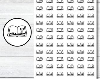 May include: A sheet of 100 black and white book stickers with a heart in the center of each book. The stickers are on a white background. The text "JUDE ANNE" appears at the top and bottom of the sheet.