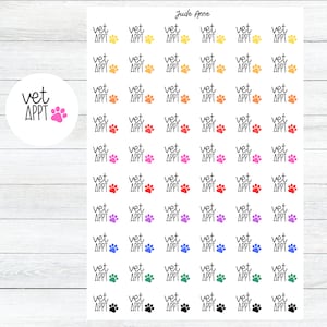May include: A sheet of colourful stickers with the text "vet appt" and a paw print. The stickers are in various colours, including yellow, orange, red, pink, purple, blue, green, and black.