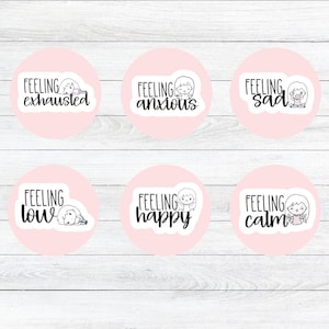 May include: A collection of six round stickers with a light pink background. Each sticker features the phrase "Feeling" followed by a different emotion: exhausted, anxious, sad, low, happy, and calm. Each sticker has a small illustration of a person.