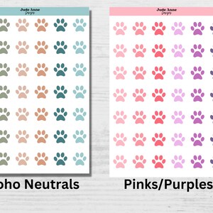 May include: Two sheets of paw print stickers. The first sheet features a variety of neutral colors, including green, brown, and blue. The second sheet features a variety of pink and purple paw prints. The text "Boho Neutrals" is printed below the first sheet and "Pinks/Purples" is printed below the second sheet.