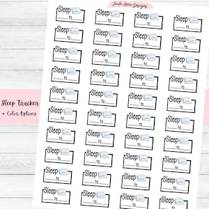 May include: A sheet of 24 black and white sleep tracker stickers with a pillow icon and the text "Sleep to" on each sticker.