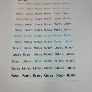 May include: A sheet of colorful stickers with the word "Dinner" written on each sticker. The stickers are arranged in rows of six.