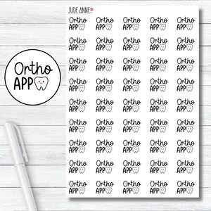 May include: A sheet of stickers with the text "Ortho APP" and a cartoon tooth design. The stickers are arranged in a grid pattern.
