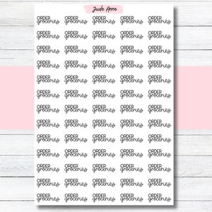 May include: A sheet of 25 black and white stickers with the text "ORDER GROCERIES" repeated in a cursive font.