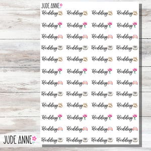 May include: Sheet of wedding-themed stickers with various designs, including wedding rings, floral bouquets, gift boxes, and a vintage car. The stickers are arranged in rows and columns, with the word "Wedding" repeated. The brand name "JUDE ANNE" is also visible.