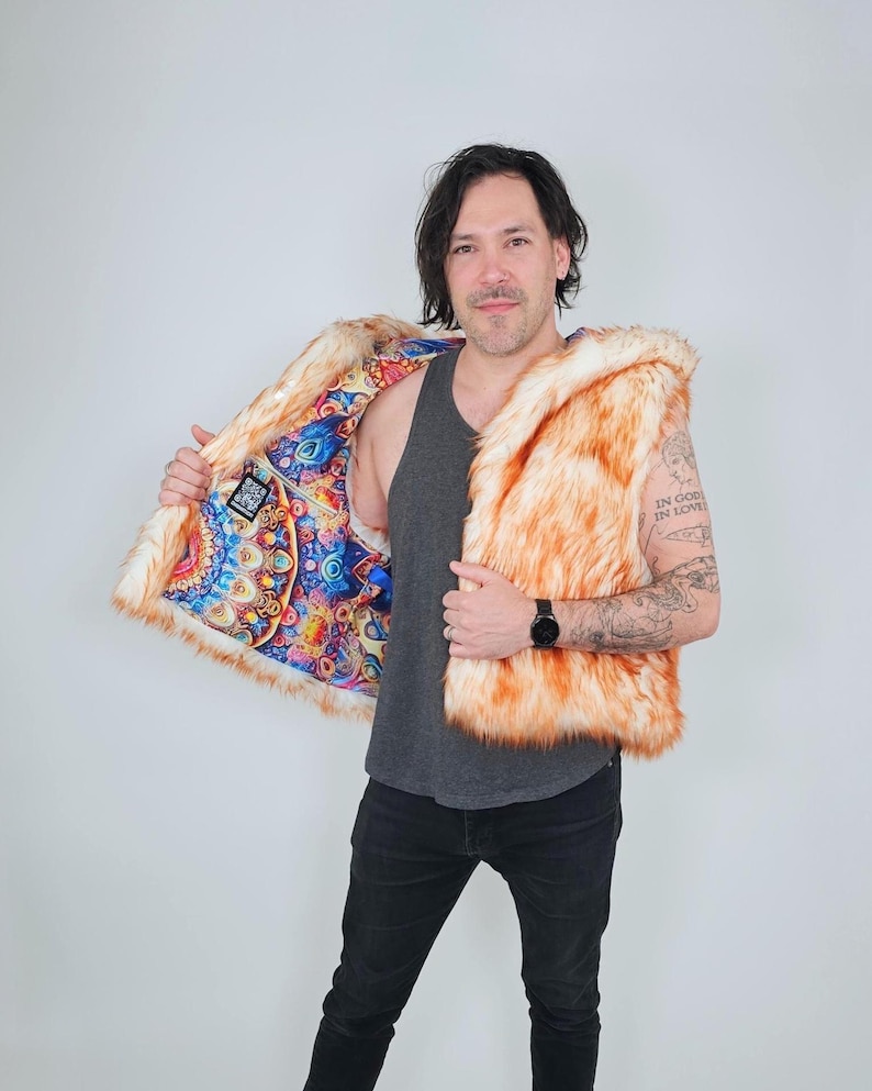 May include: A sleeveless vest made of orange and white faux fur. The interior lining features a vibrant, multicolored psychedelic mandala pattern with intricate geometric shapes and circular designs in shades of blue, red, yellow, and purple.