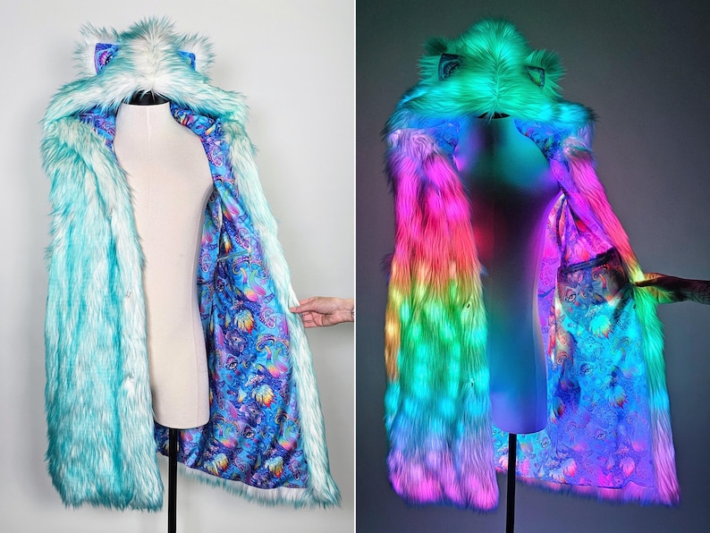 May include: A long-sleeved faux fur coat featuring a hood with ears, rendered in light blue. The interior lining displays a vibrant, multicolored psychedelic pattern. The coat is equipped with integrated LED lights that glow in pink, green, and blue.