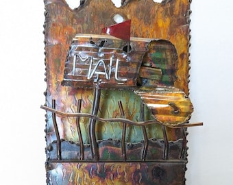 Vintage metal mail sorter with two slots and key hooks at bottom. Patina seen across sorter, make in Hong Kong. 70s