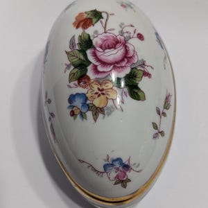 Vintage porcelain floral egg trinket box, Japan.  small chip on inside lid.
