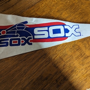 Vintage MLB Chicago White Sox felt pennant with small stains visible as seen in photo