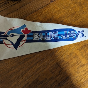 Vintage MLB Toronto Blue Jays felt pennant.  full size with small stains