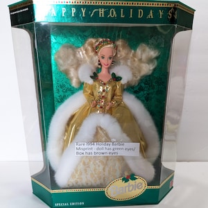 Vintage Mattel 1994 Happy Holidays Barbie special edition doll. In factory sealed box, with a 5 by 7 Barbie poster.  see below..