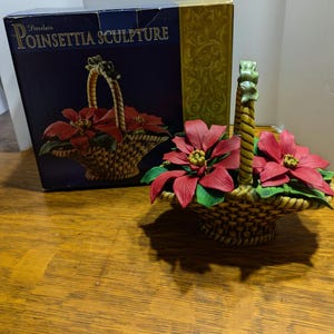 Vintage Classic Treasures porcelain poinsettia sculpture, in original box.  Larger bloom is loose in basket and one chip on leaf, see photos