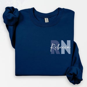 Custom Registered Nurse Sweatshirt With Name, Personalized RN Pocket Hoodie, Nurse Life Outfit, Cute Nurse Gift, Nurse Appreciation Clothing