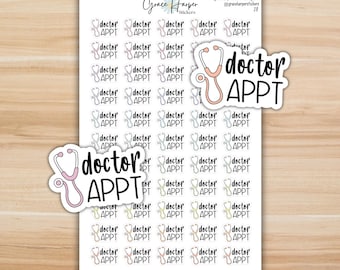 May include: A sticker sheet featuring multiple rows of small, colorful stethoscope icons paired with the black text "doctor APPT". Two larger, die-cut stickers with the same stethoscope design and "doctor APPT" text are placed over the sheet.