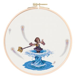 May include: A cross-stitch pattern of a female character with brown hair and a blue dress standing on a swirling blue water platform. The character is holding a staff with a golden orb at the end. There are several white and blue swirls around the platform.
