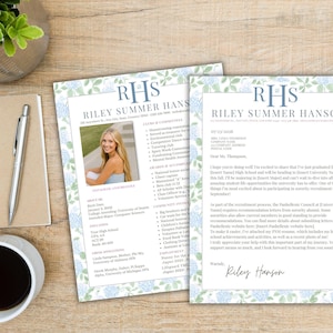 May include: Two printed documents with a floral border and the name "Riley Summer Hanson" in blue. One document includes a photo of a young woman. A pen, notebook, and coffee cup are on a wooden surface.