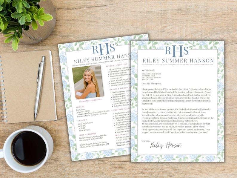 May include: Two printed documents with a floral border and the name "Riley Summer Hanson" in blue. One document includes a photo of a young woman. A pen, notebook, and coffee cup are on a wooden surface.