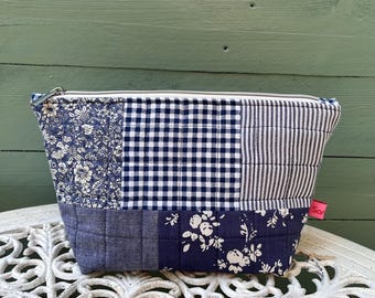 Quilted patchwork vintage fabric zipped pouch, lined with pretty floral vintage fabric. Sustainably handmade & eco friendly.