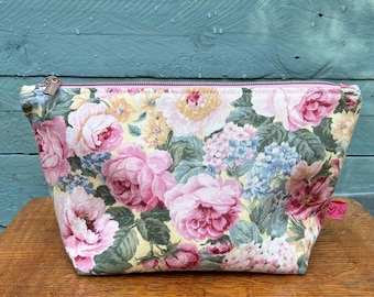 Vintage fabric zipped pouch. Lined with more pretty vintage fabric. Ideal for makeup, toiletries, crafts and more. Upcycled and sustainable.
