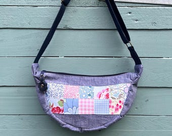 Patchwork round mini cross body/shoulder bag with beautiful vintage floral lining. 2 slip pockets. Zip closure. Upcycled & vintage fabric.