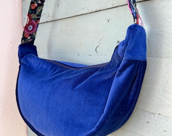 Lush navy velvet round cross body/shoulder bag. Vintage velvet outer, vintage cotton lining, colourful strap. Upcycled fabric.