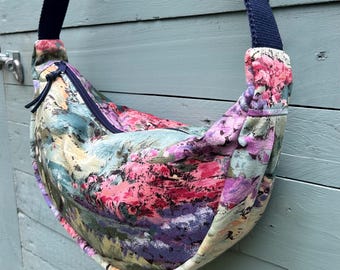 Vintage fabric round cross body bag, in colourful Impressionist style fabric. Fabulous vintage lining. Two slip pockets.