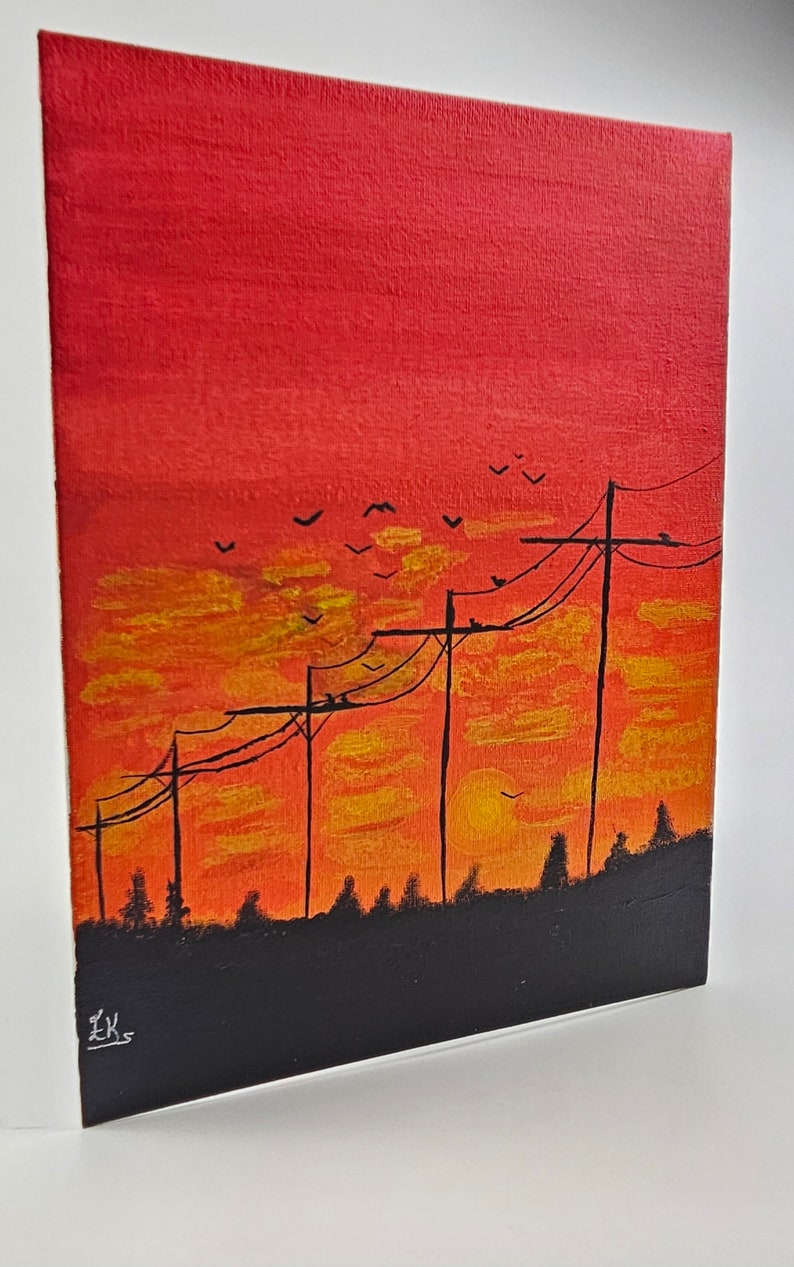 May include: A painting of a sunset with silhouetted trees and power lines. The sky is a vibrant orange and red with yellow clouds. Birds are flying in the sky.