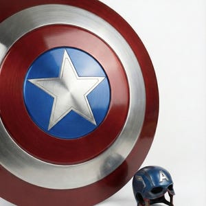 Captain America inspired shield constructed from steel with classic star and circular pattern.
Metal Captain America shield made of steel, designed for fans, collectors, and cosplay enthusiasts.