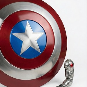 Steel Captain America shield replica with a glossy finish for display and costume purposes.
Captain America themed shield crafted from steel, not vibranium, for cosplay and decoration.
Durable steel shield inspired by Captain America’s iconic design, ideal for display.