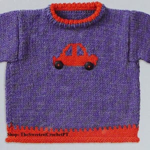 May include: A purple long-sleeve knit sweater featuring a bright orange ribbed collar, cuffs, and hem. The center of the sweater displays an orange car appliqué with two dark brown circular buttons as wheels. The text Shop: TheSweetestCrochetPT is visible.